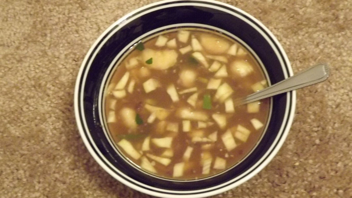 Bowl of Chunky Vegetable Soup on Carpet