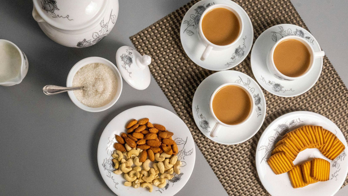 Tea time with biscuits and mixed nuts