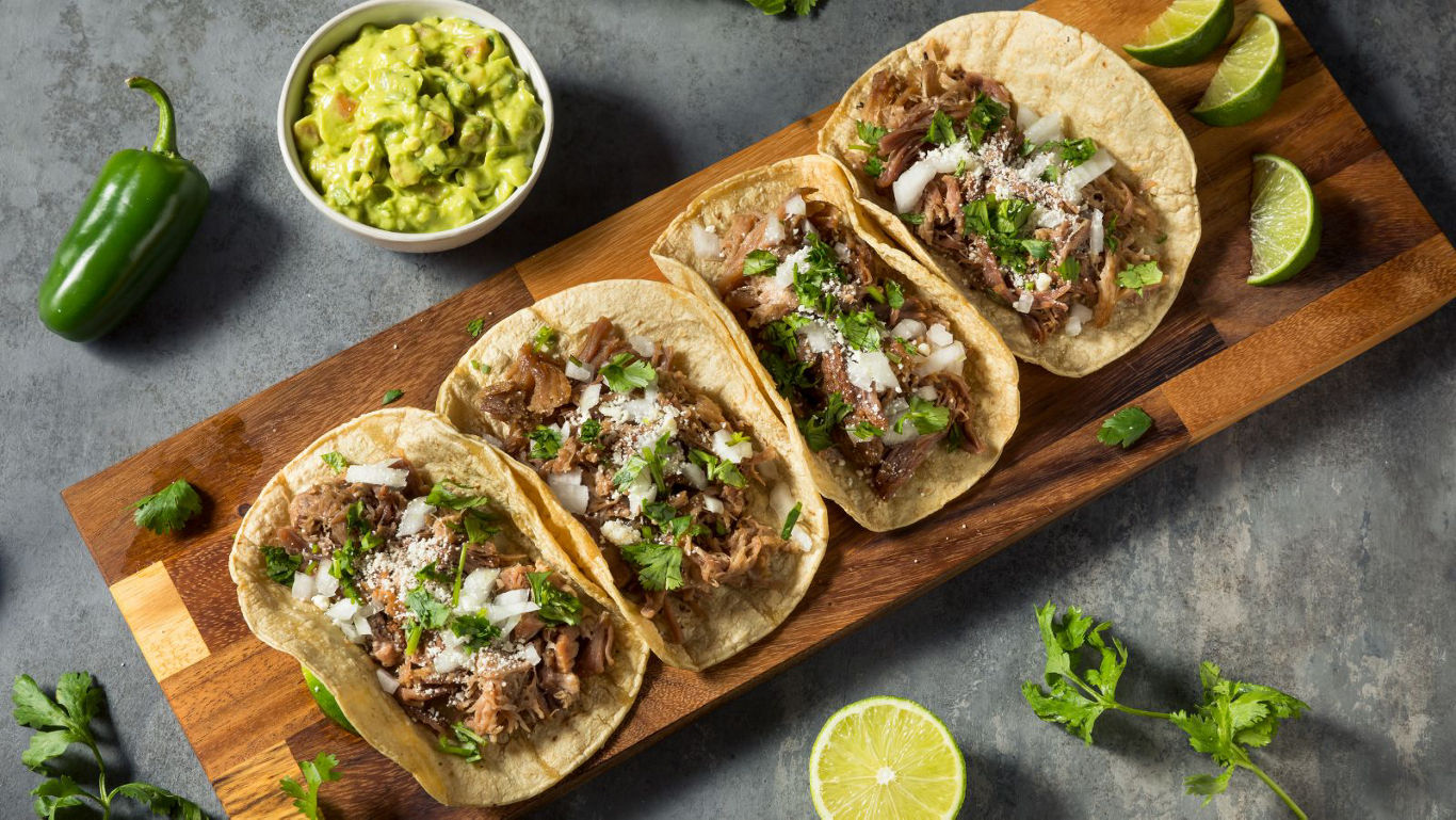 Street style beef tacos with lime wedges