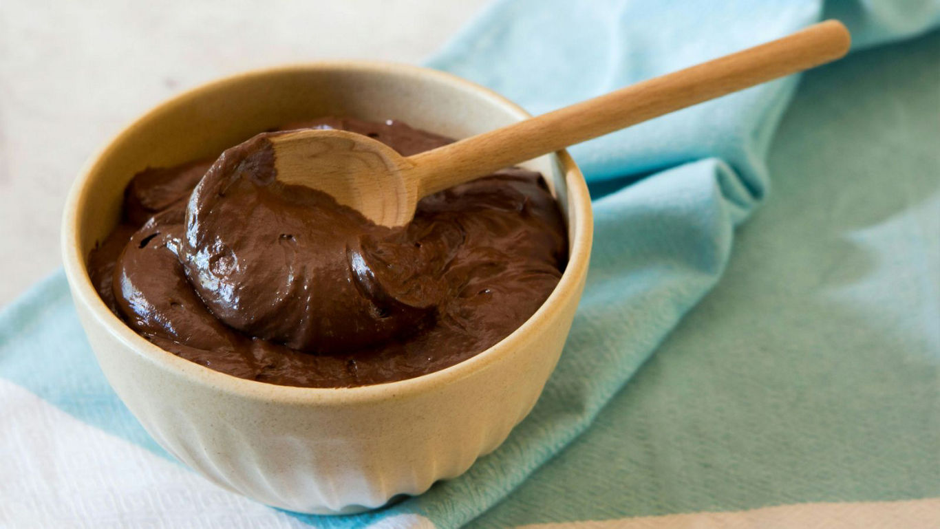 Creamy chocolate dessert in ceramic bowl