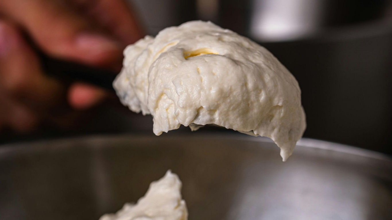Close-up of spoonful of bread dough