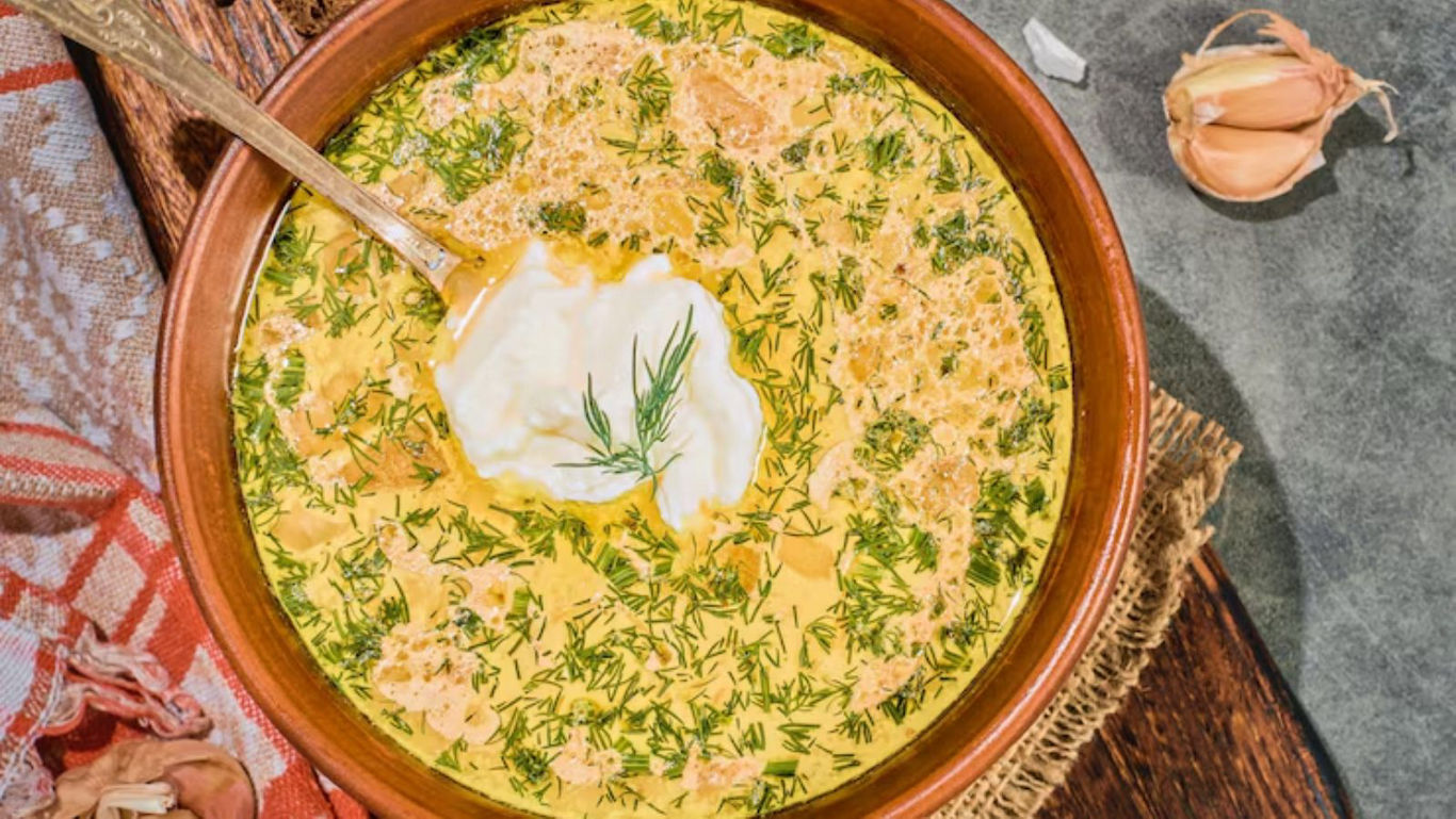 Creamy soup with fresh herbs and garlic