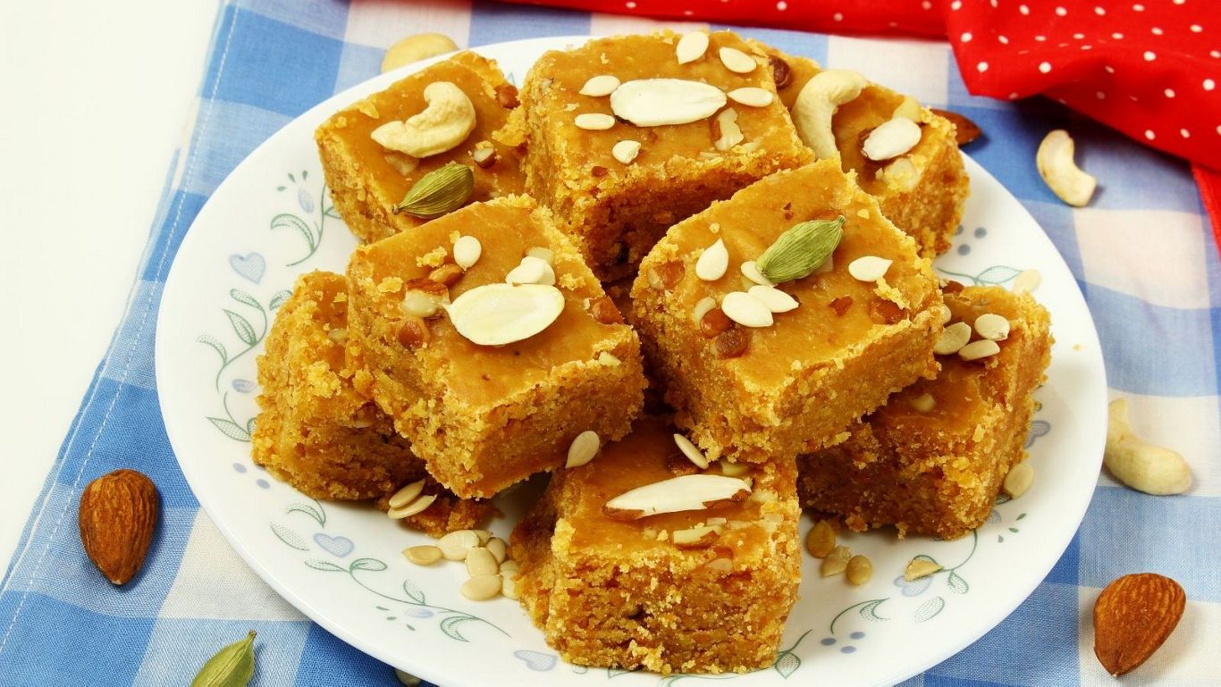 Plate of Indian sweet barfi with nuts