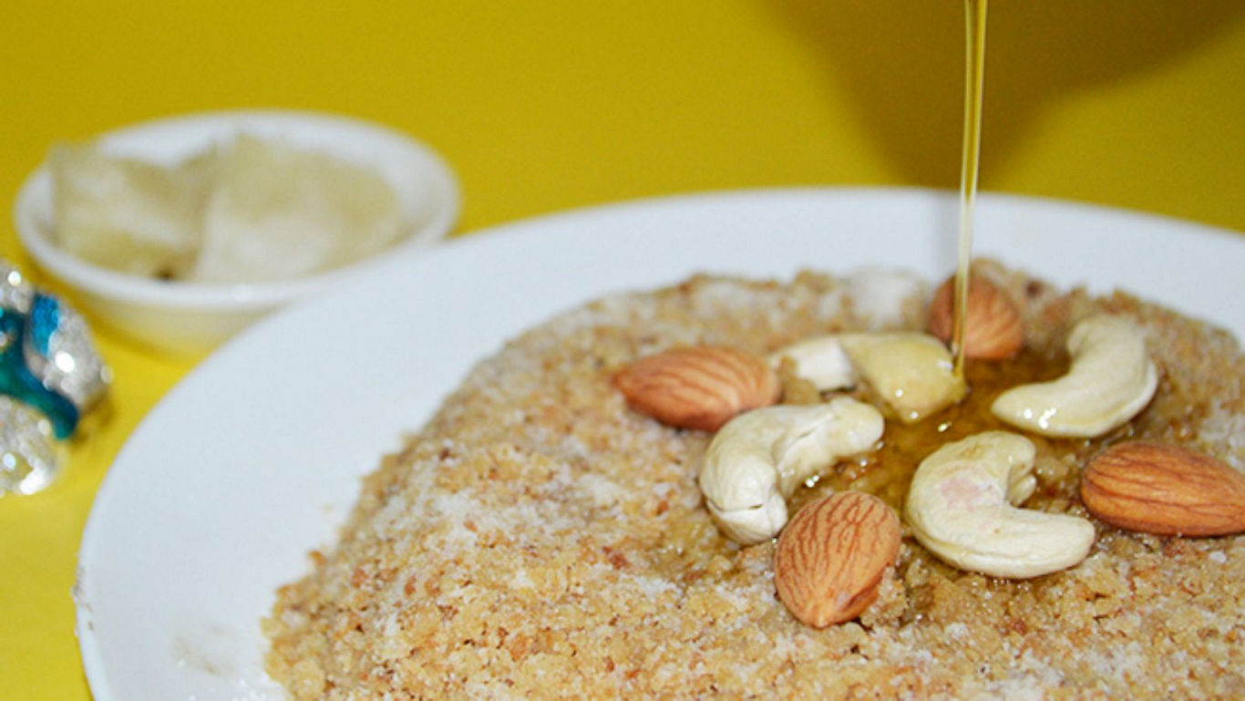 Honey poured over nut garnished dessert