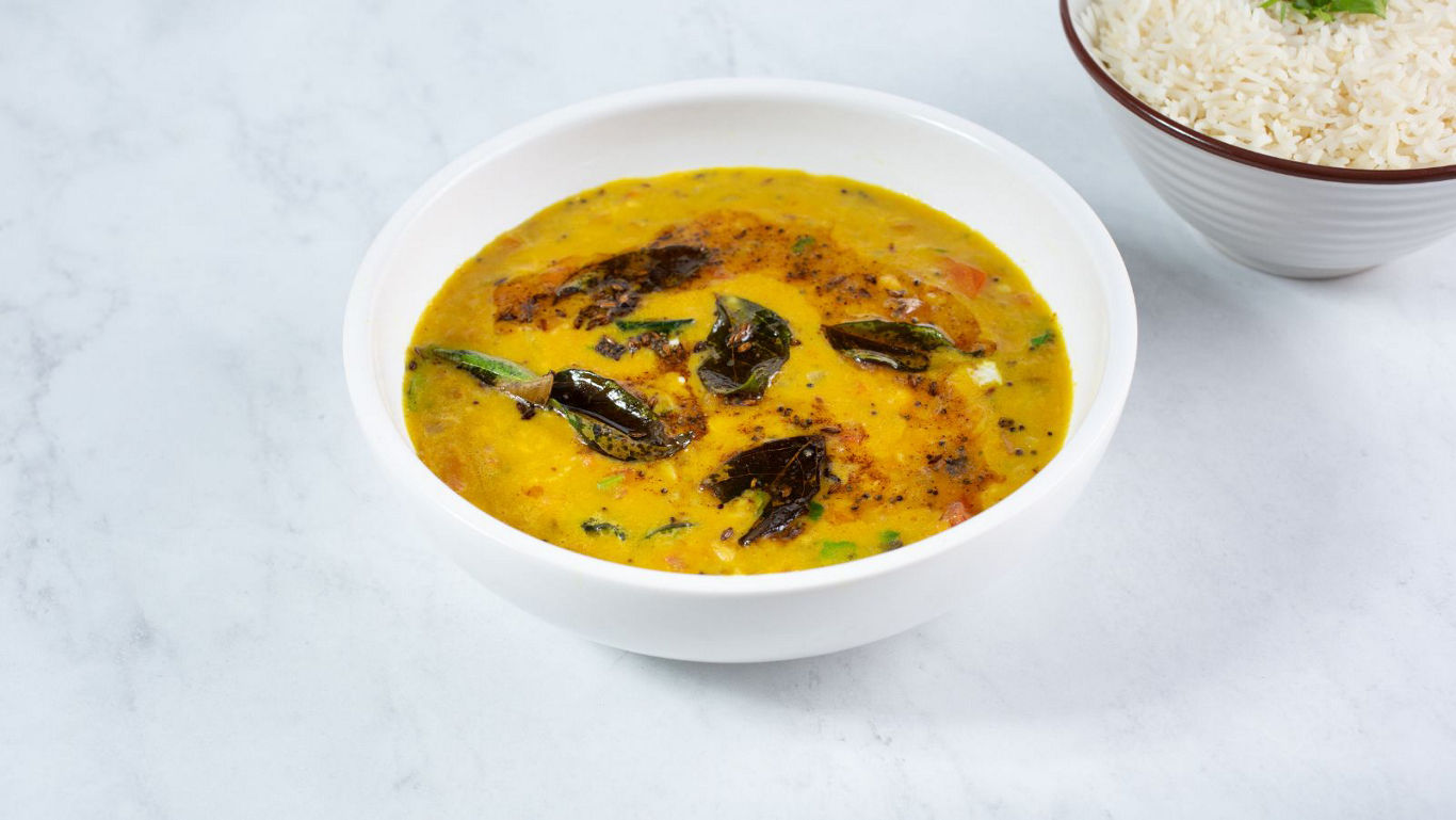 Indian yellow dal tadka served with steamed rice