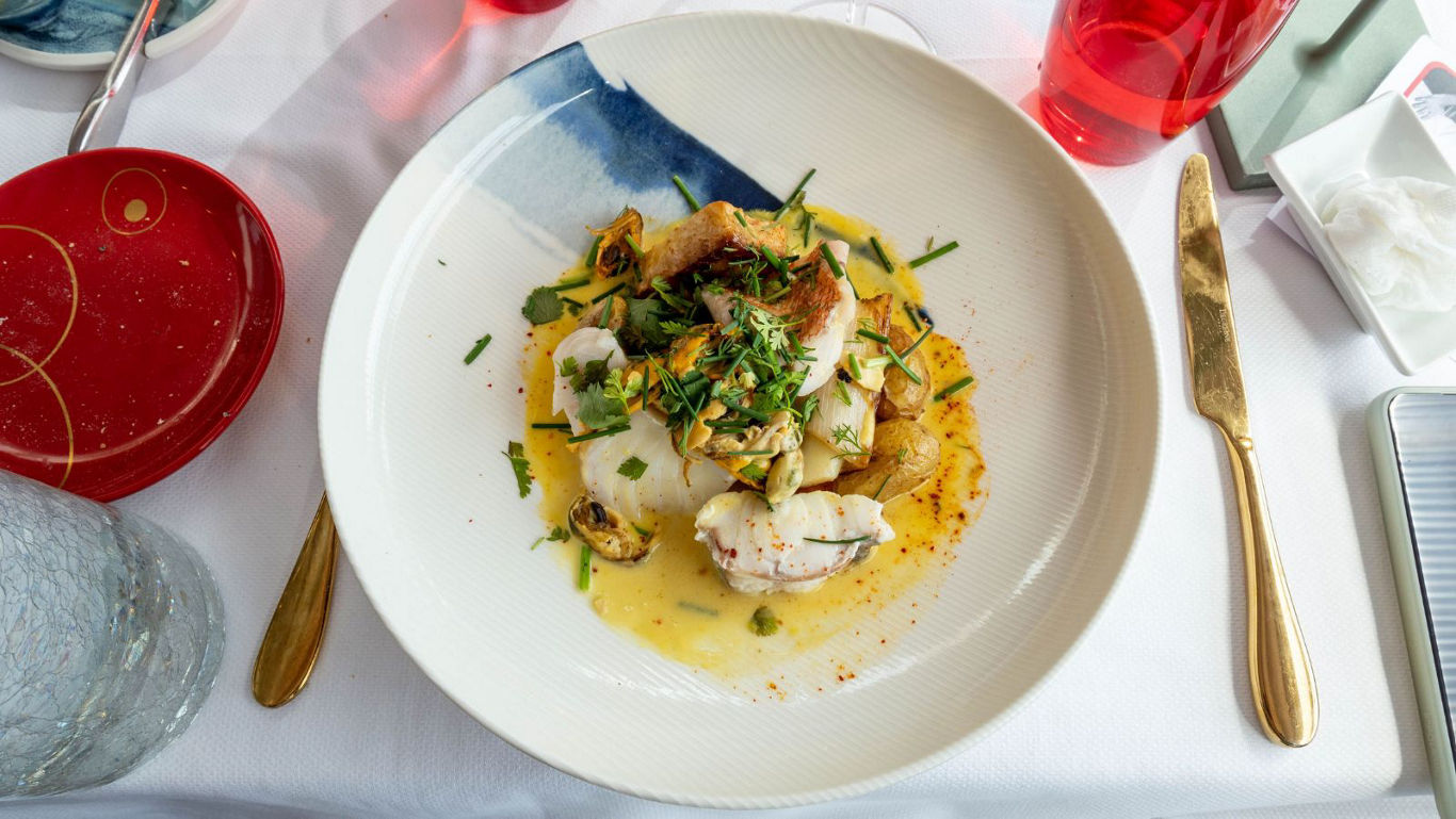 Gourmet seafood dish in fine dining setting