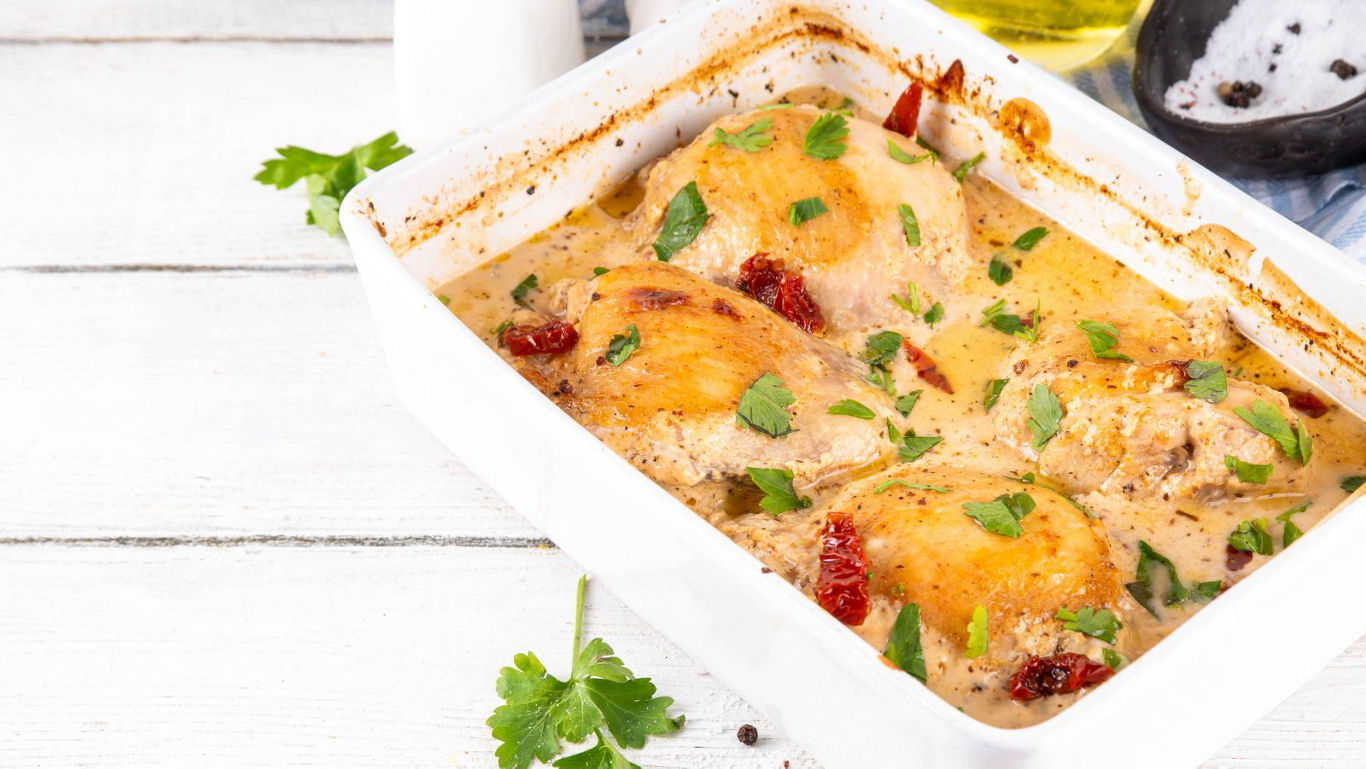 Baked Chicken Thighs in Creamy Herb Sauce