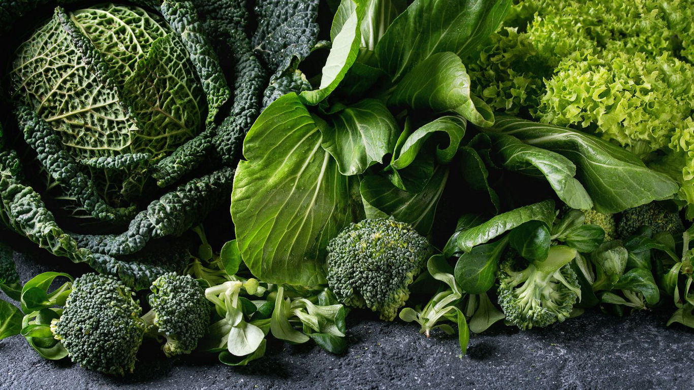 Assorted fresh green leafy vegetables closeup