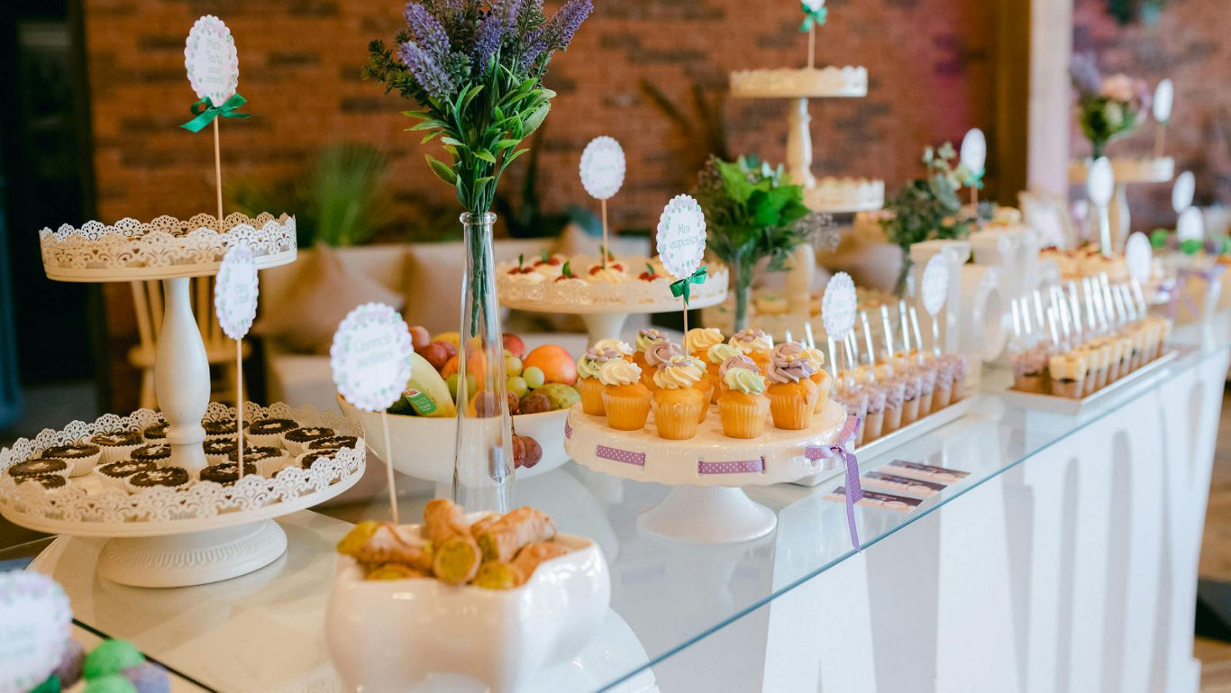 Elegant dessert table with cupcakes and treats