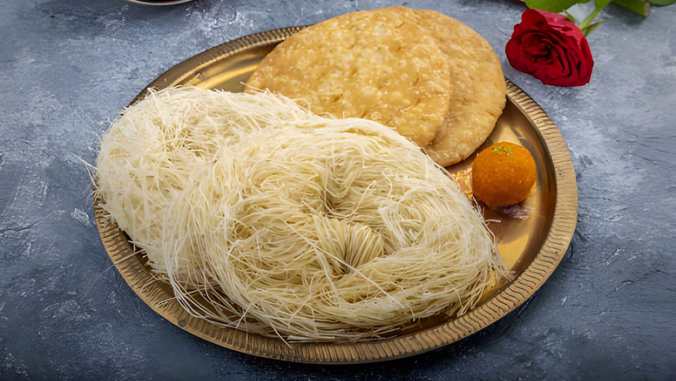 Traditional Indian sweets on golden plate