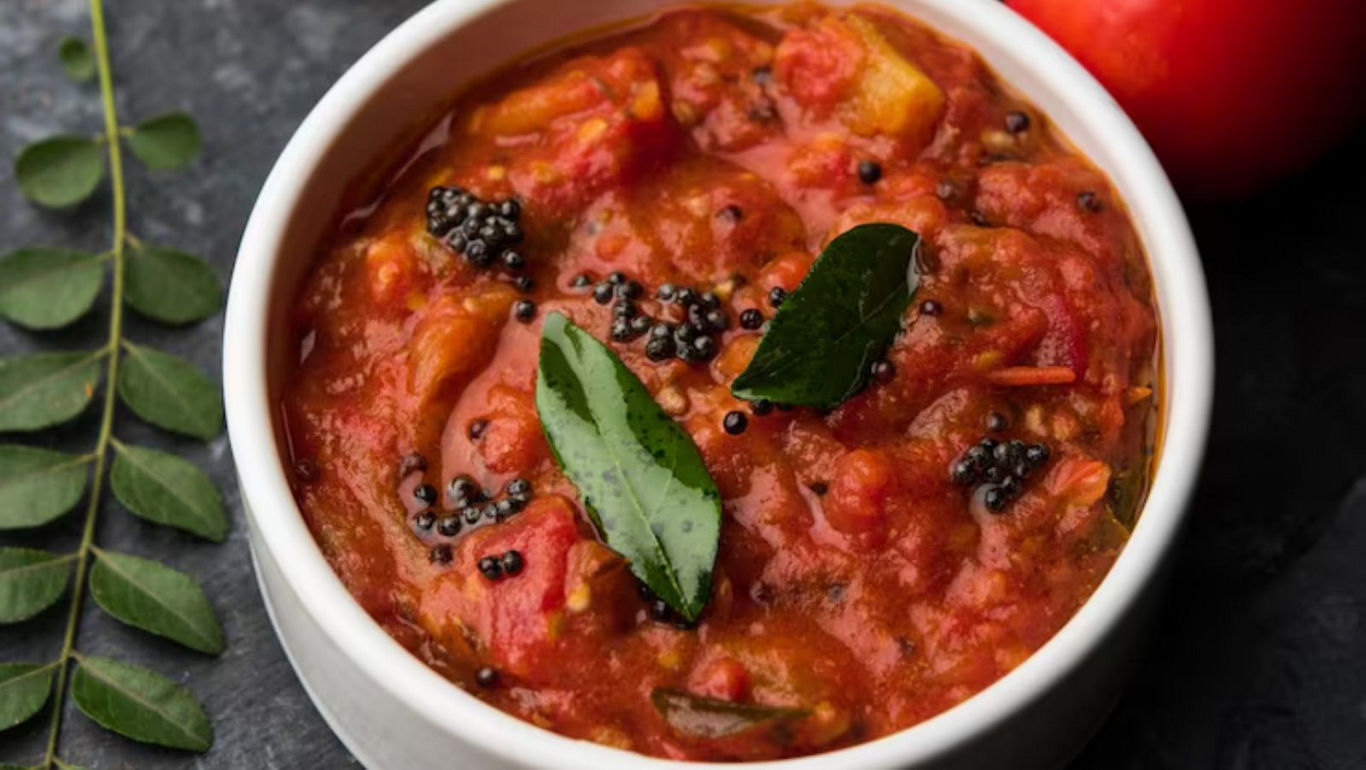 Spicy tomato curry with fresh herbs