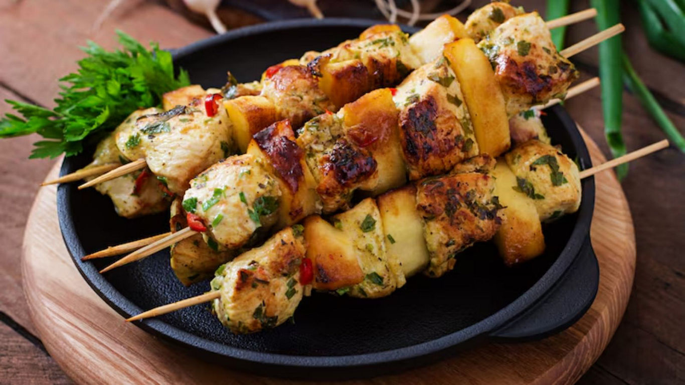 Grilled chicken skewers with herbs and spices
