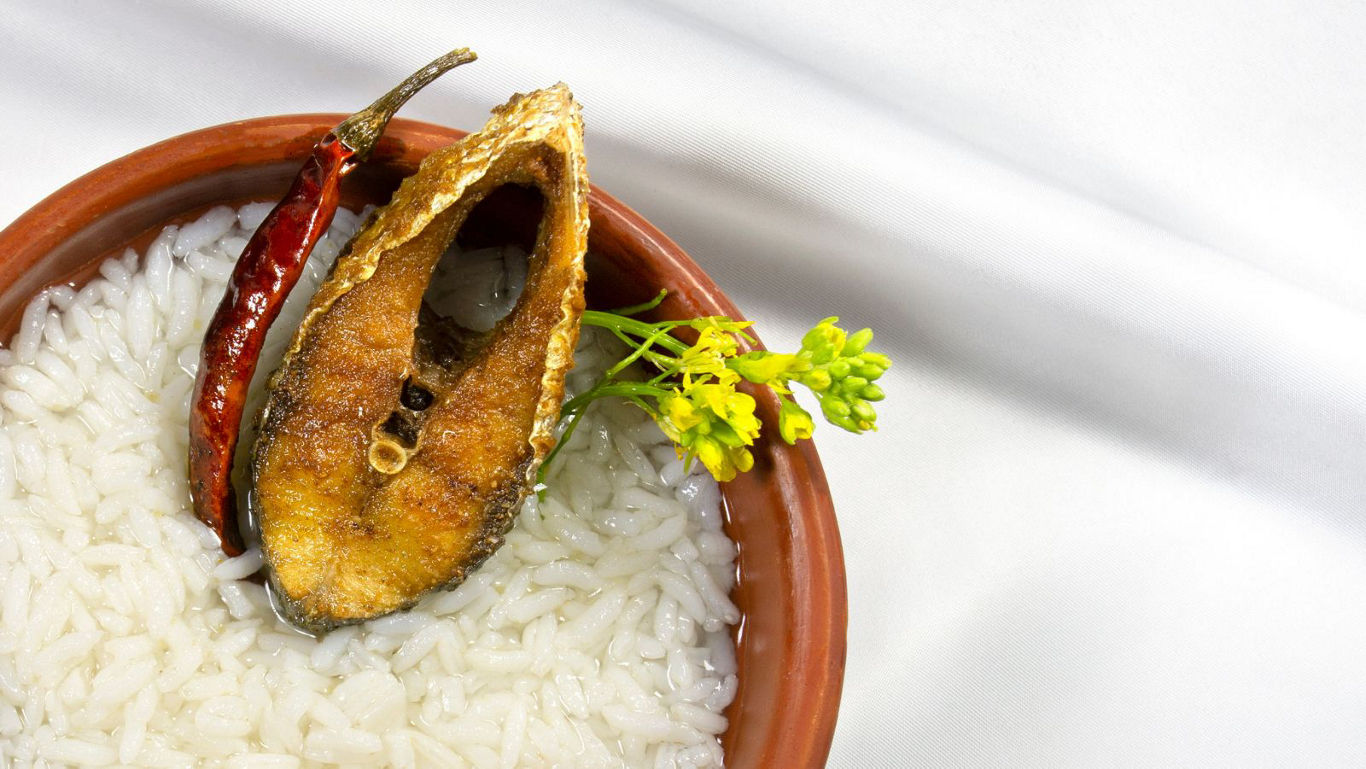 Fried fish with rice and red chili