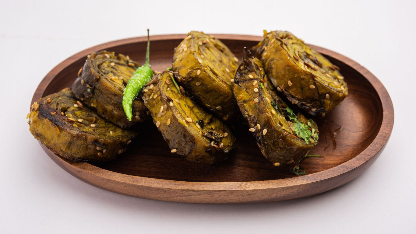 Traditional Indian Patra Rolls on Wooden Plate