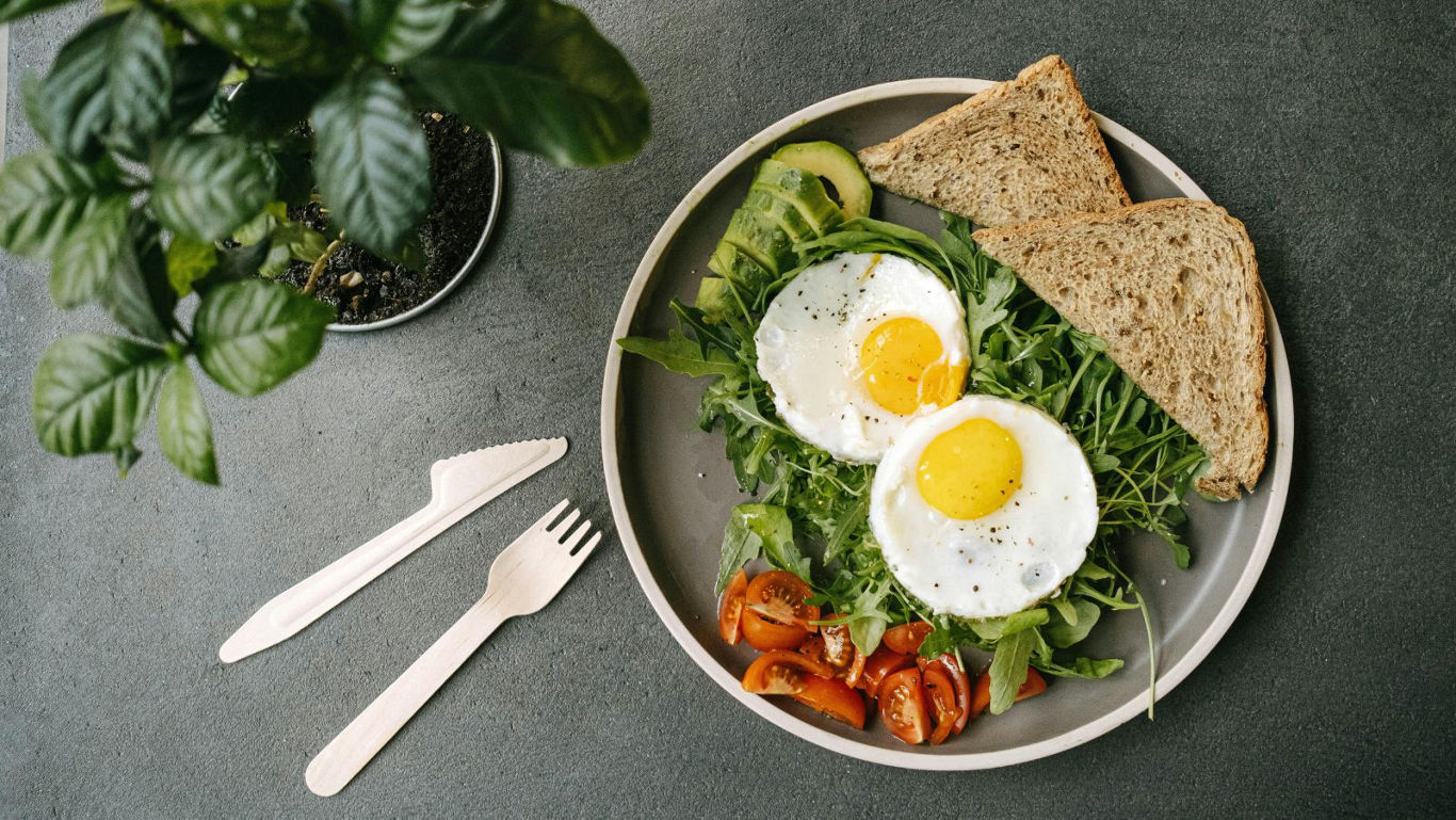 Healthy breakfast plate with eggs and vegetables