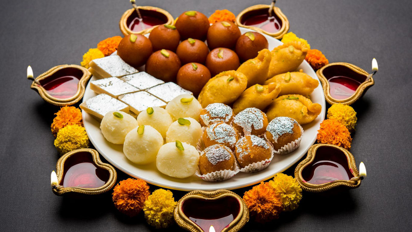 Traditional Indian sweets with festive decor