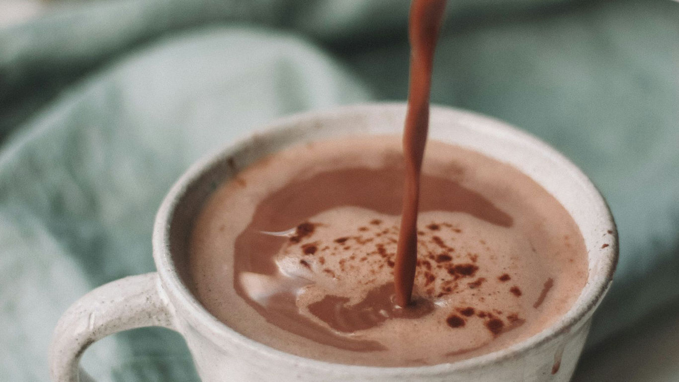 Hot chocolate being poured into mug