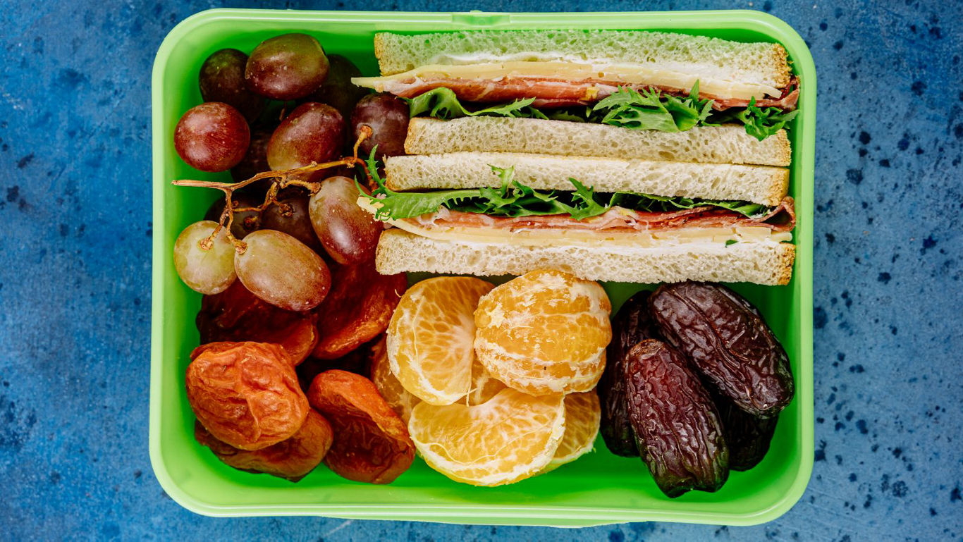 Healthy lunchbox with fruits and sandwich