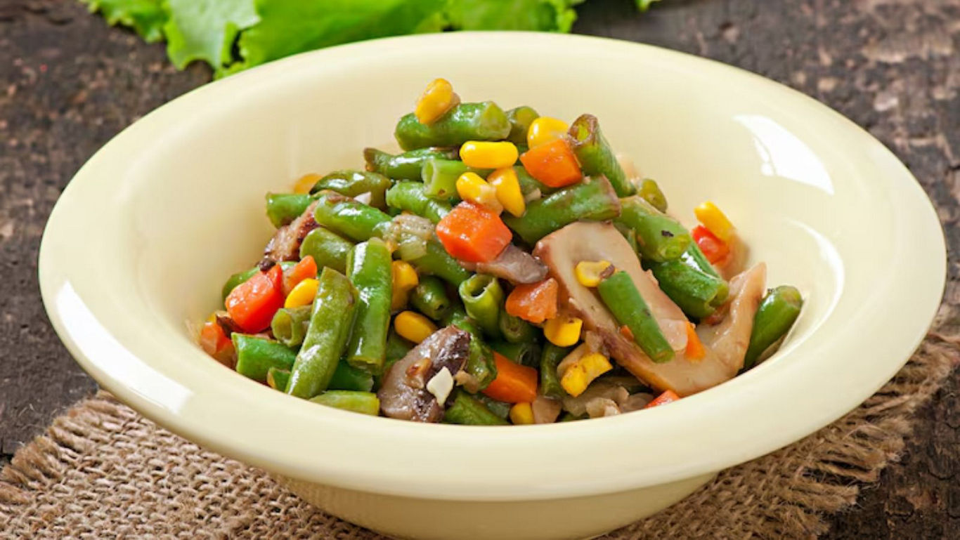 Mixed vegetable medley served in cream ceramic bowl