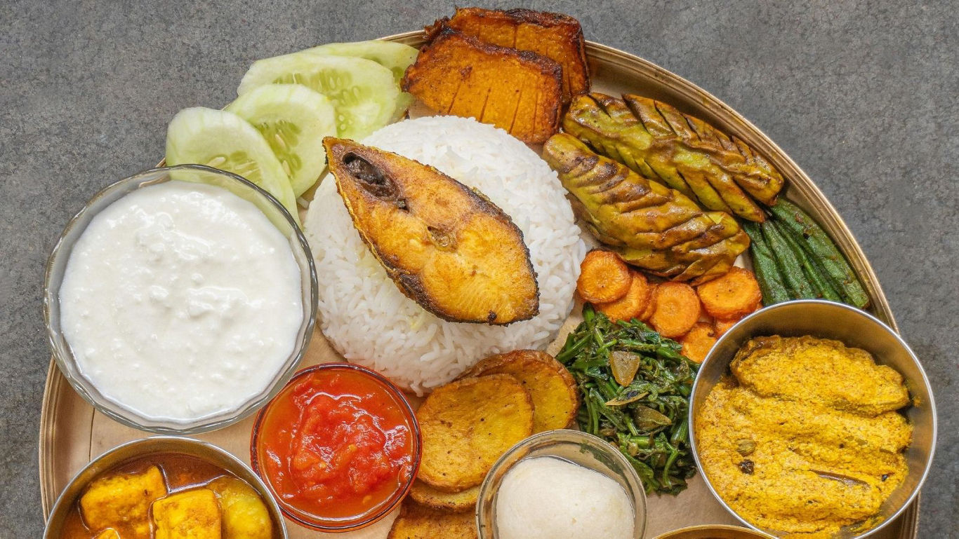 Traditional Indian thali with fried fish