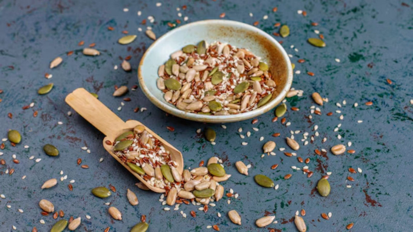 Assorted Mixed Seeds in Bowl and Wooden Scoop