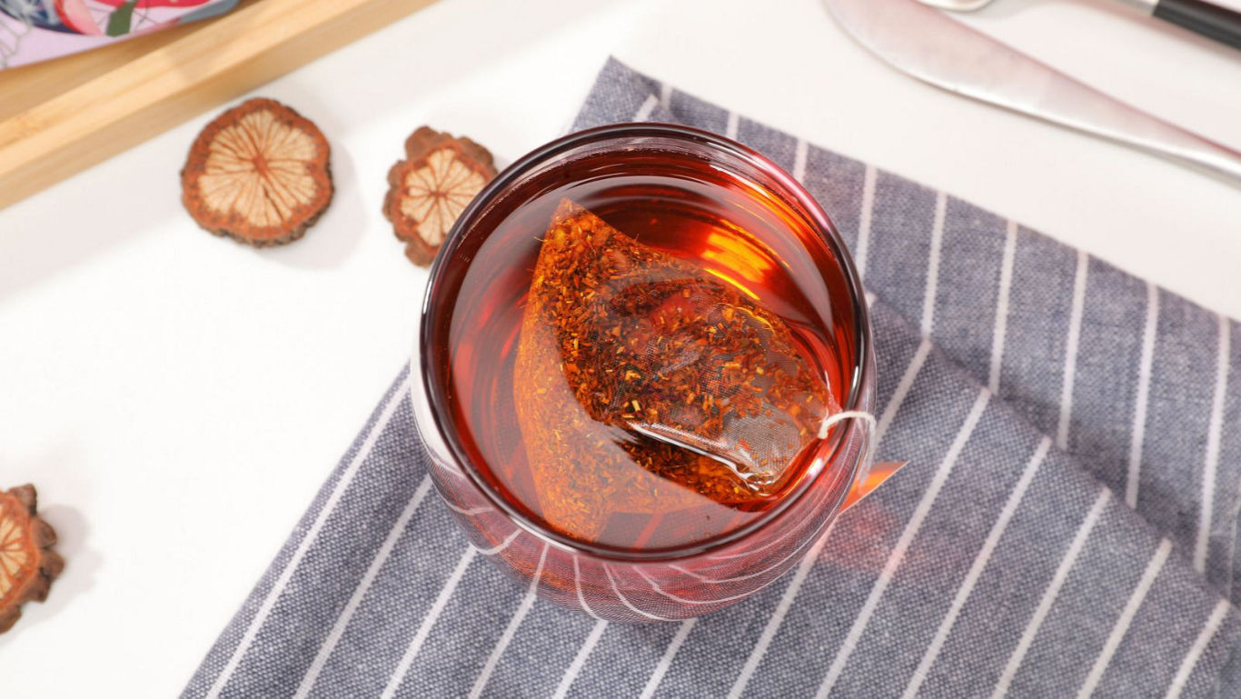 Glass of herbal tea with dried slices