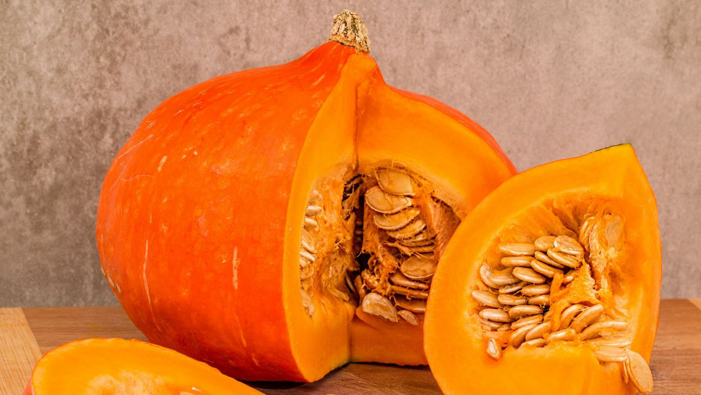 Fresh orange pumpkin cut into wedges