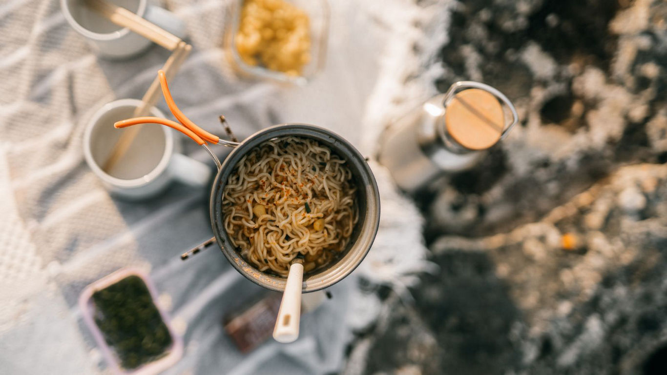 Outdoor Picnic with Instant Noodles and Hot Drink