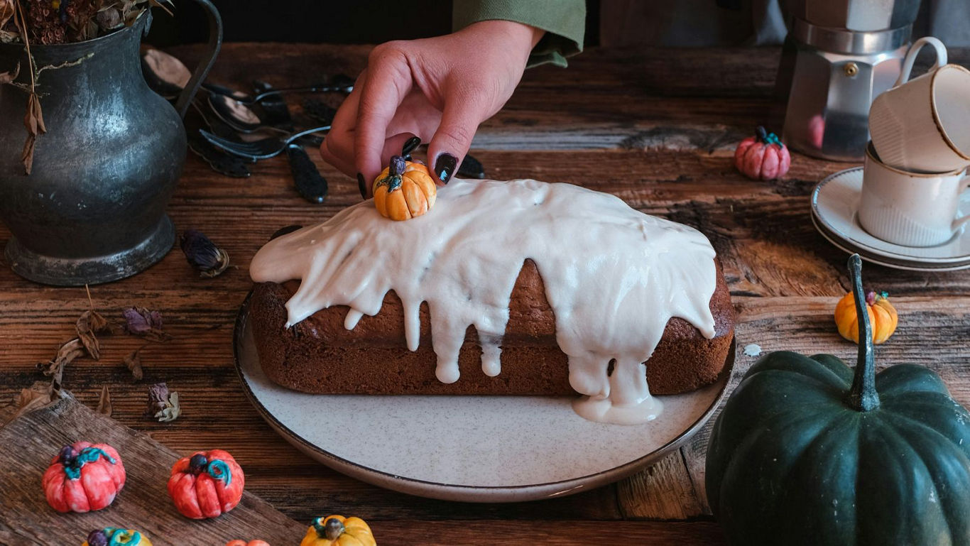 Decorating pumpkin loaf with icing