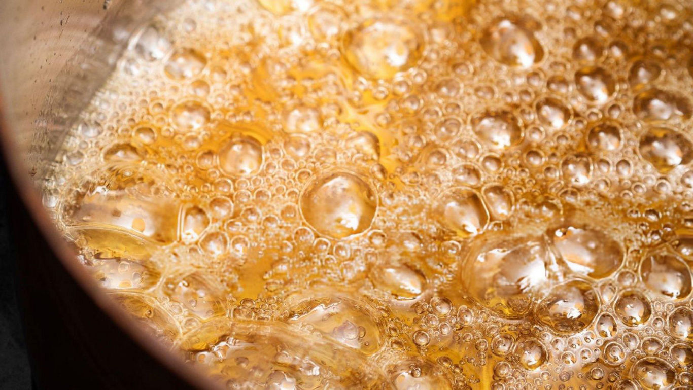 Close-up of bubbling caramel in pan