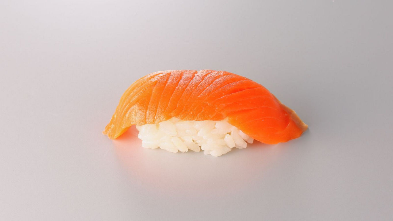 Single piece of fresh salmon nigiri sushi