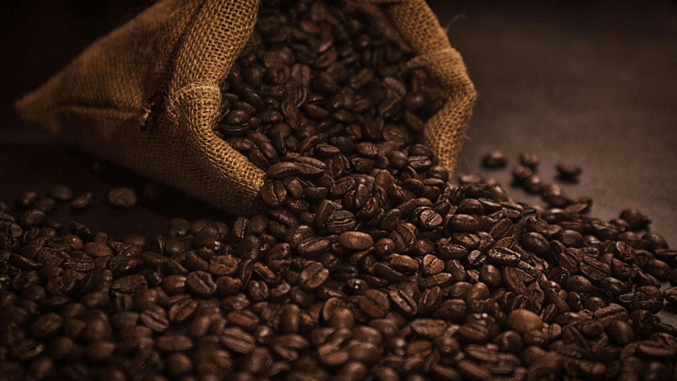 Burlap Sack Spilling Coffee Beans