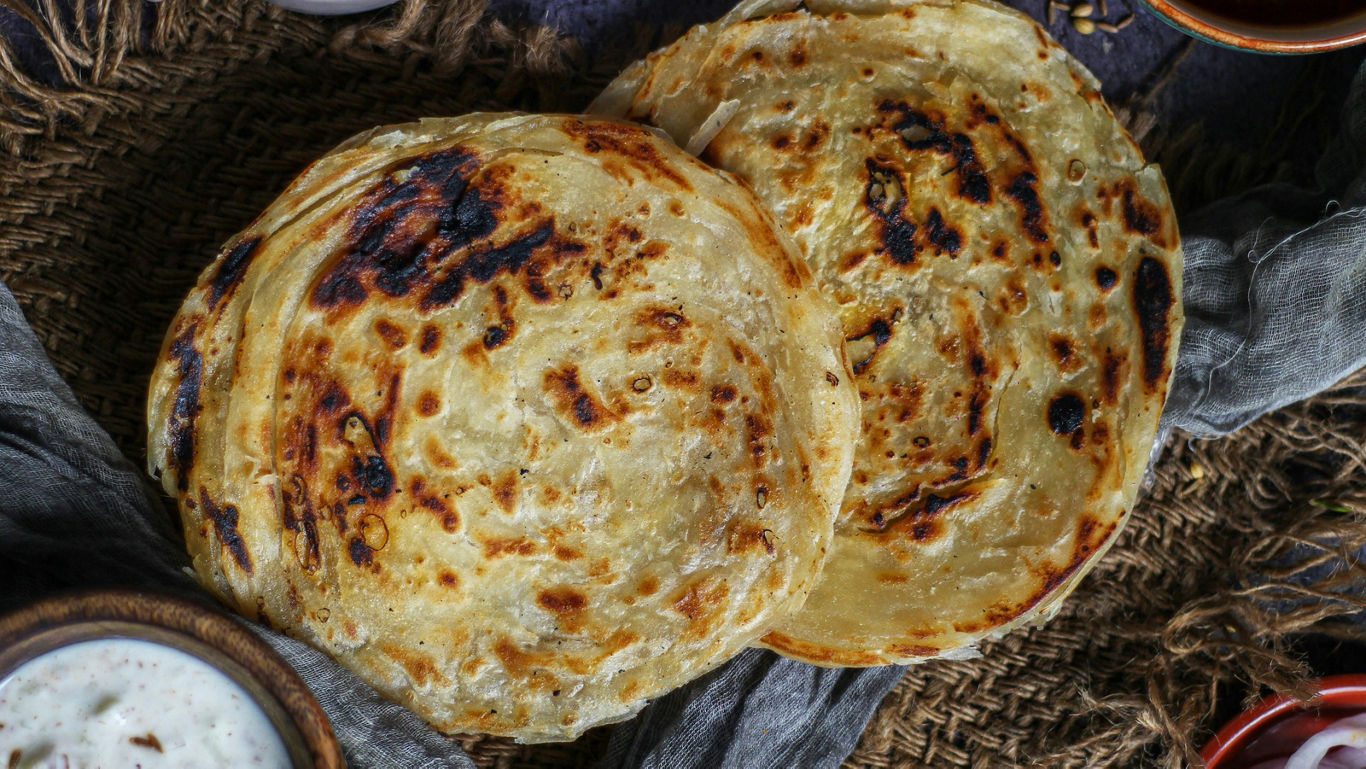 Kerala Parotta Vs. North Indian Paratha: A Study In Technique, Texture, And Terminology