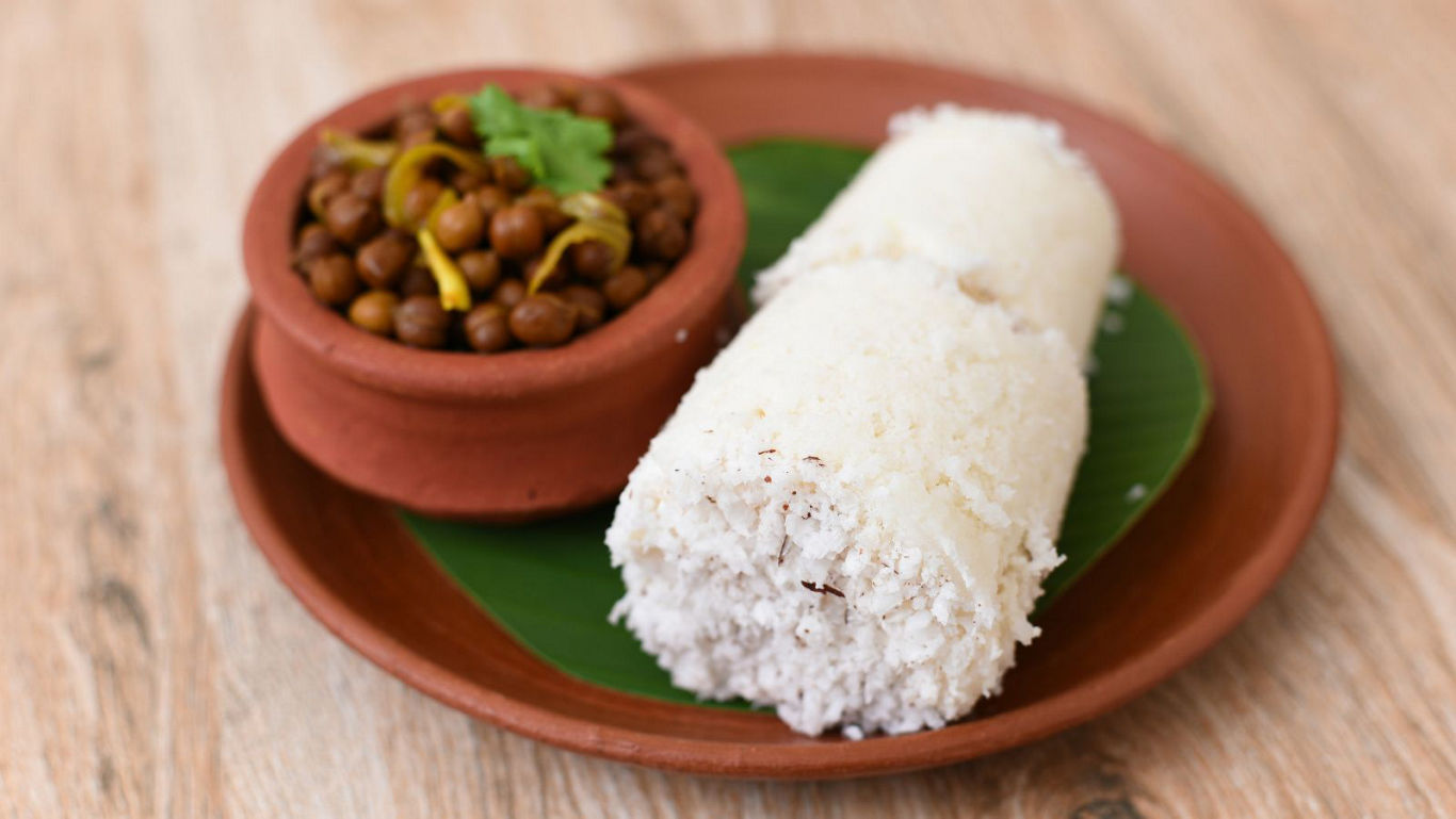 Traditional South Indian puttu with chickpeas curry