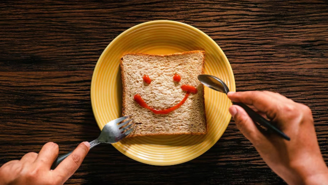 Smiley face on bread with utensils