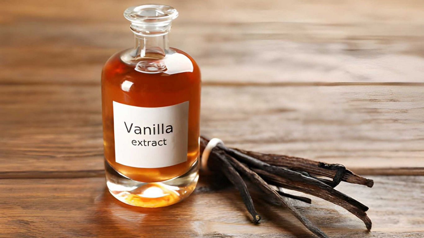 Glass bottle of vanilla extract with vanilla beans