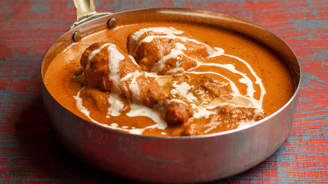 Creamy Butter Chicken in Copper Pan on Table