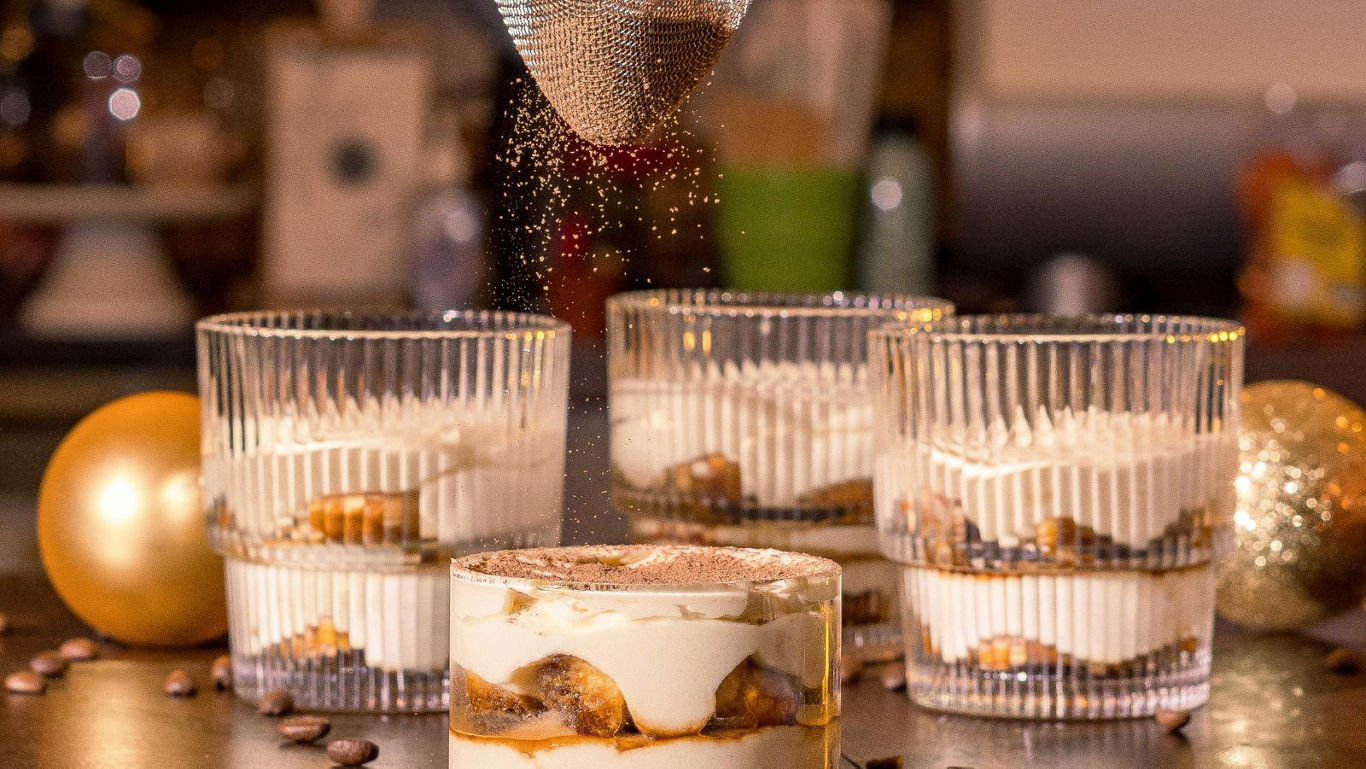 Layered dessert with cocoa dusting