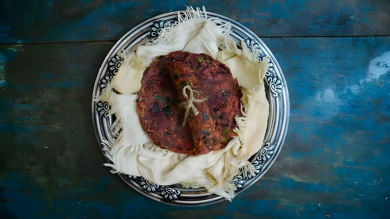 Traditional flatbread and shredded cheese on patterned plate