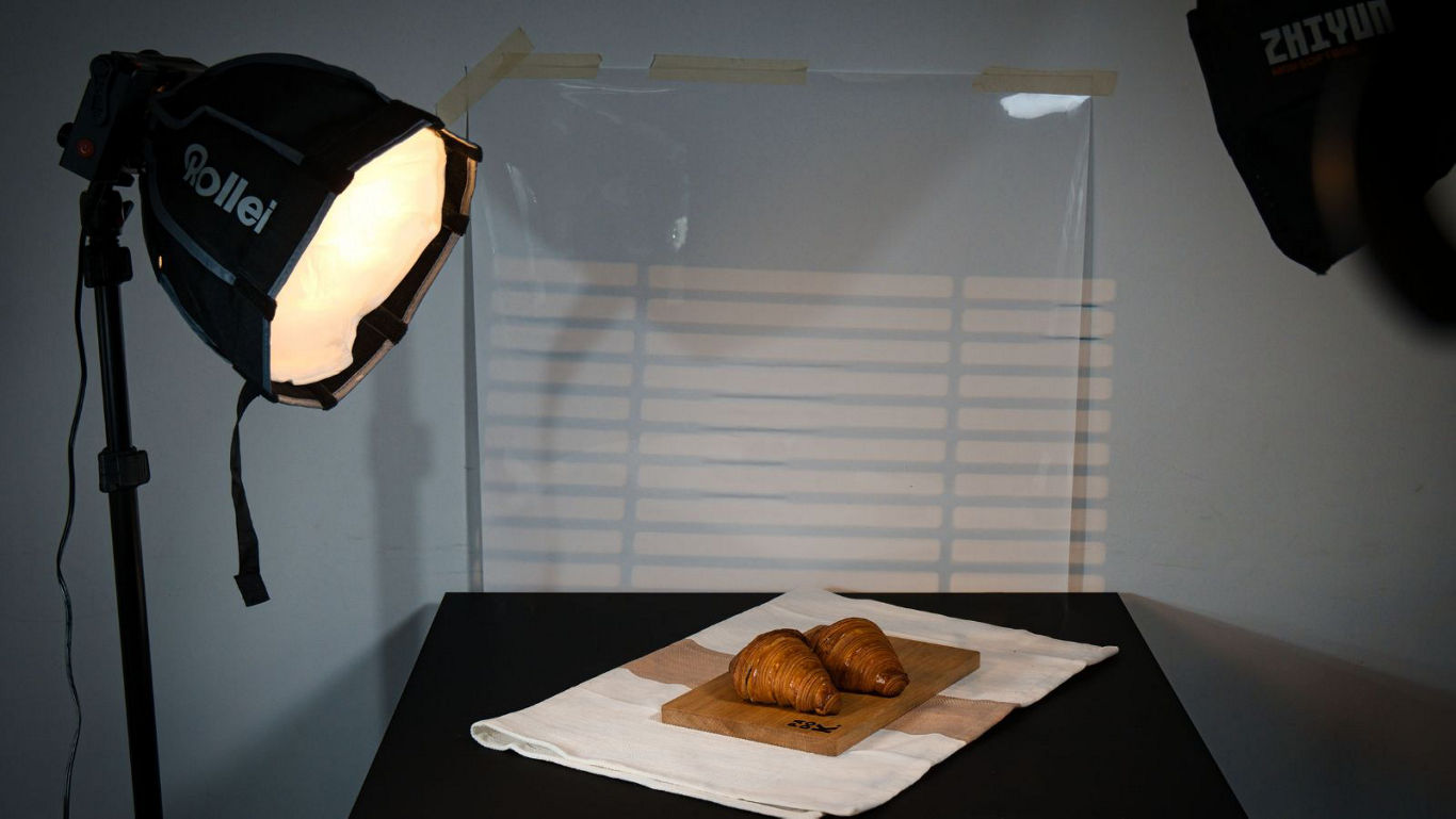 Studio food photography setup with croissants