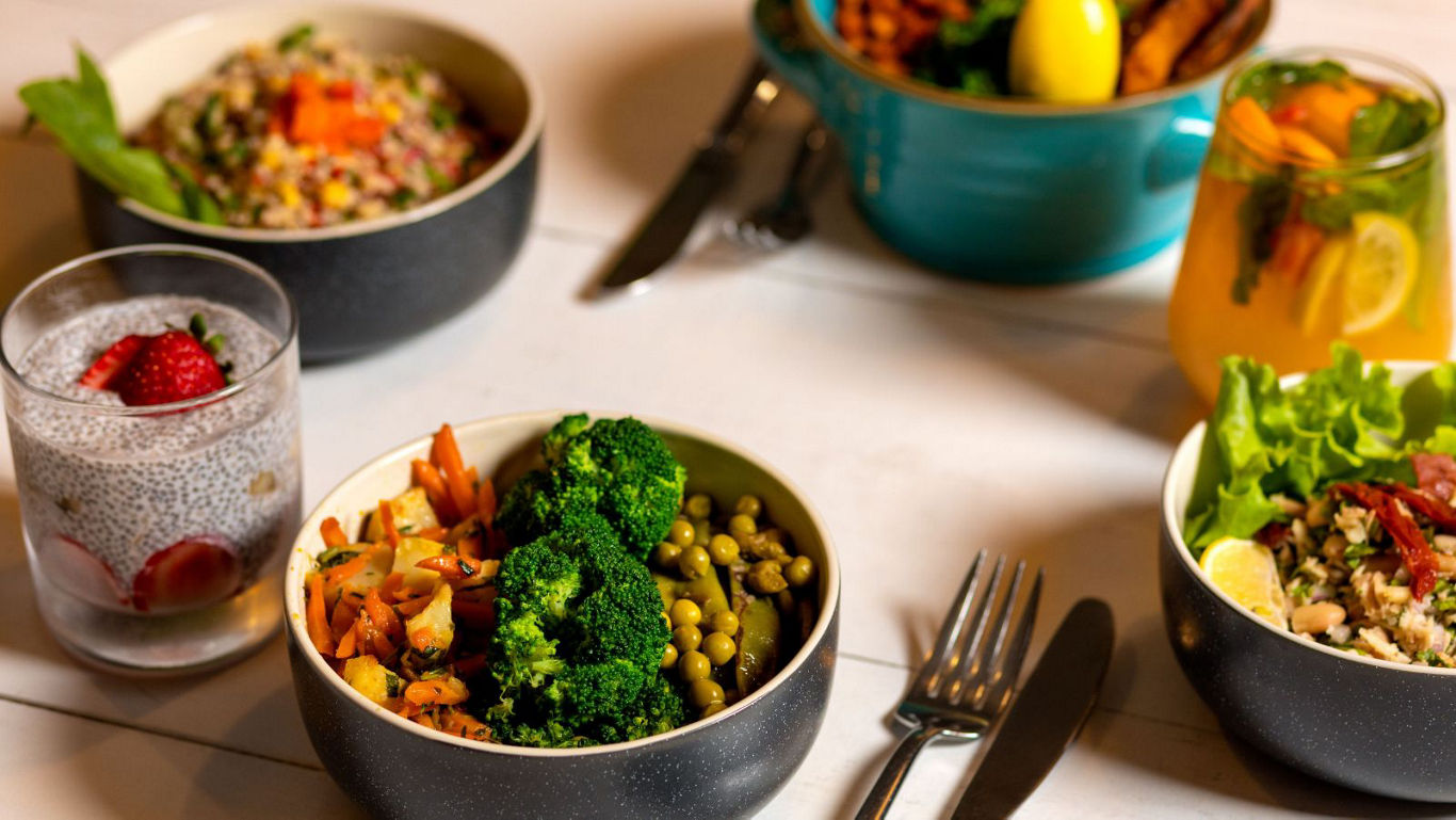 Colorful healthy meal bowls and drinks