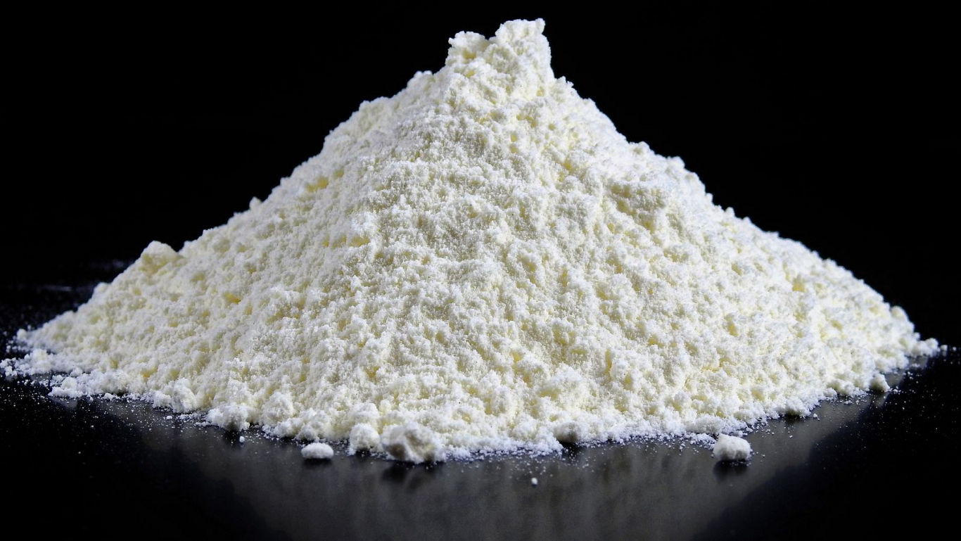 Pile of white powder on dark background
