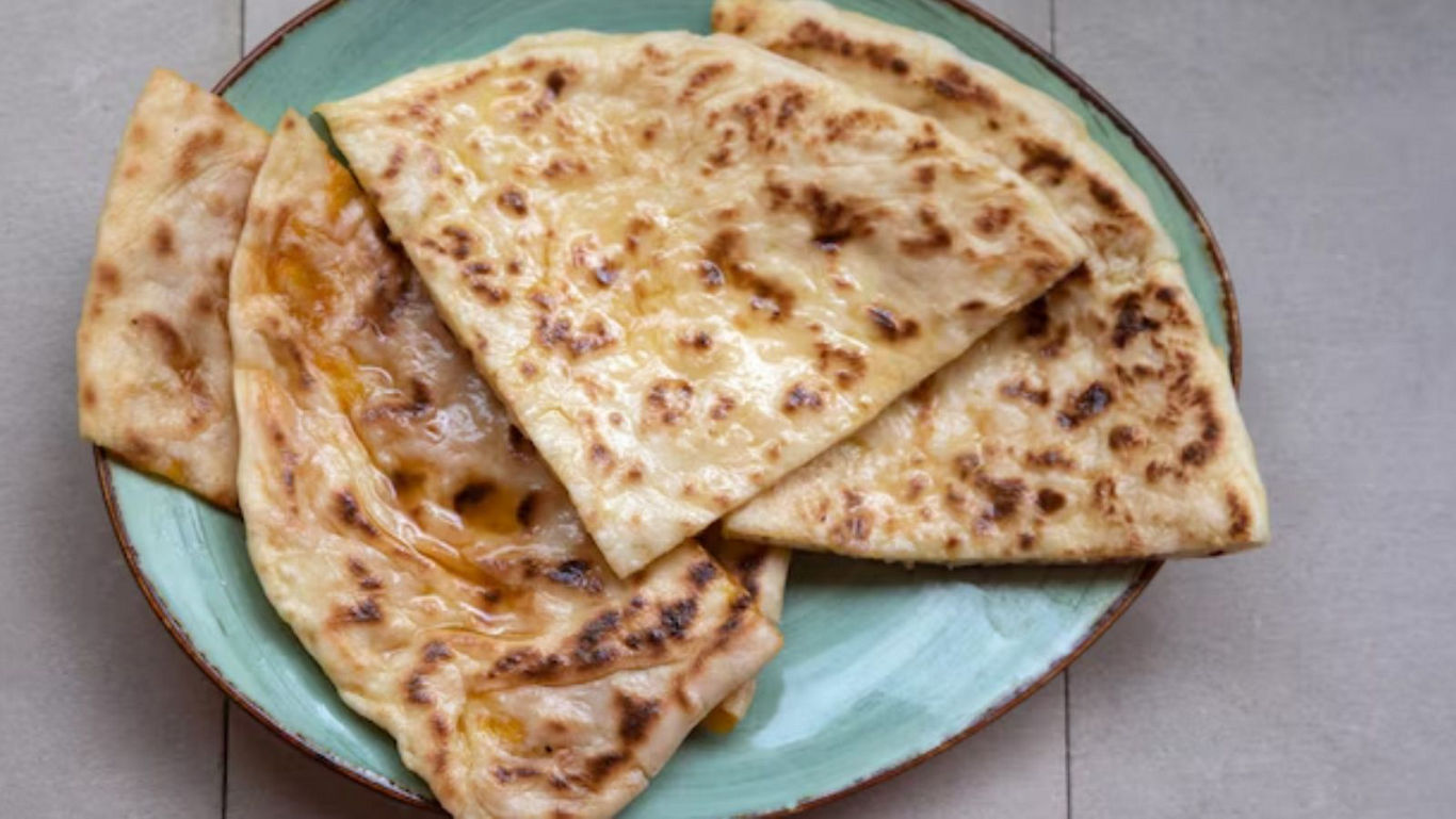 Freshly Cooked Flatbread on Green Ceramic Plate