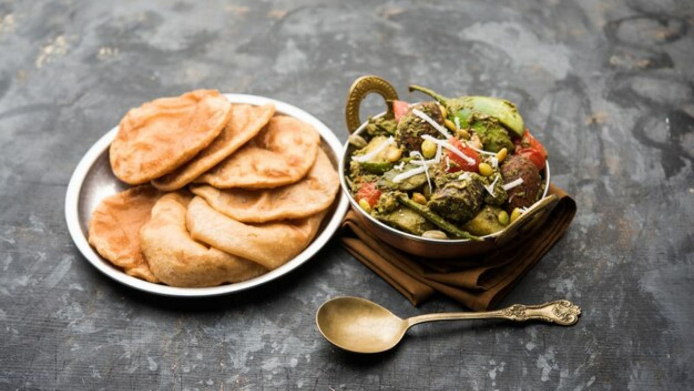 Traditional Indian Poori with Mixed Vegetable Curry