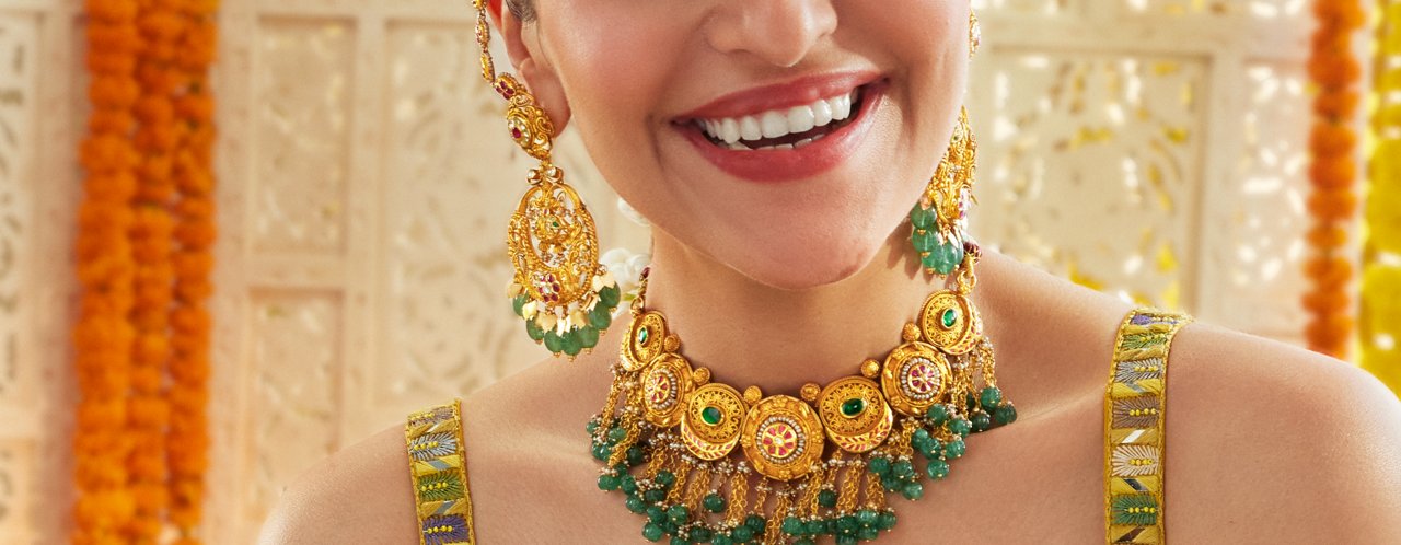 Vibrant Gold and Emerald Jewelry, Including Earrings and a Matching Necklace