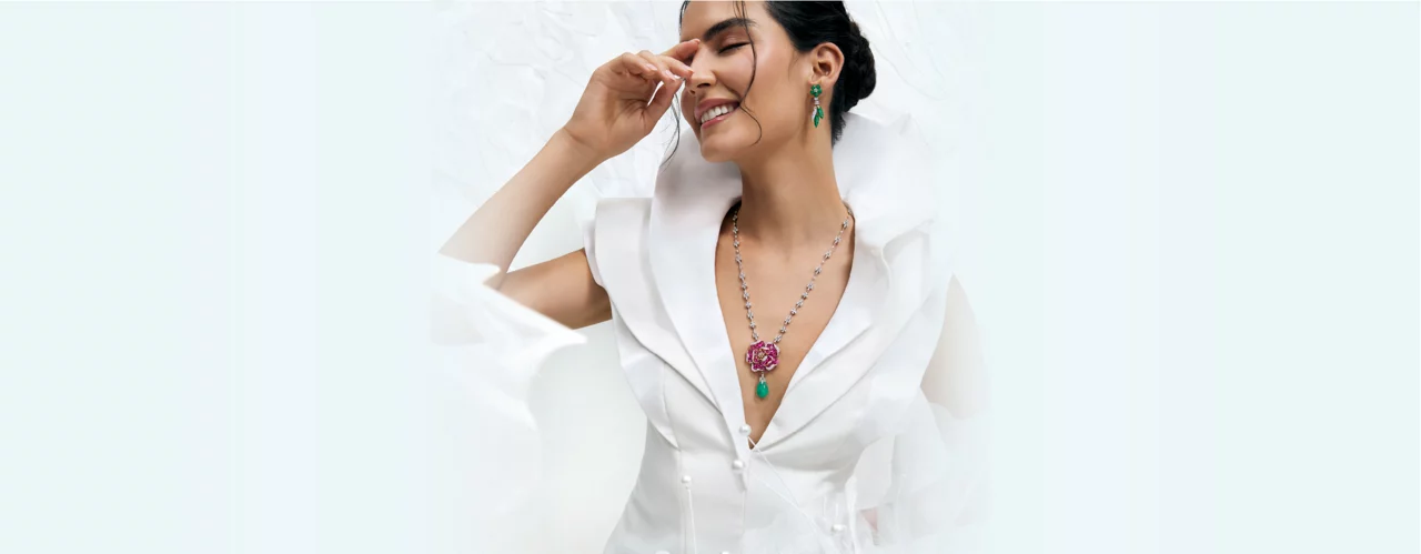 Model in vibrant gemstone necklace and matching earrings from Garden of Emotions collection