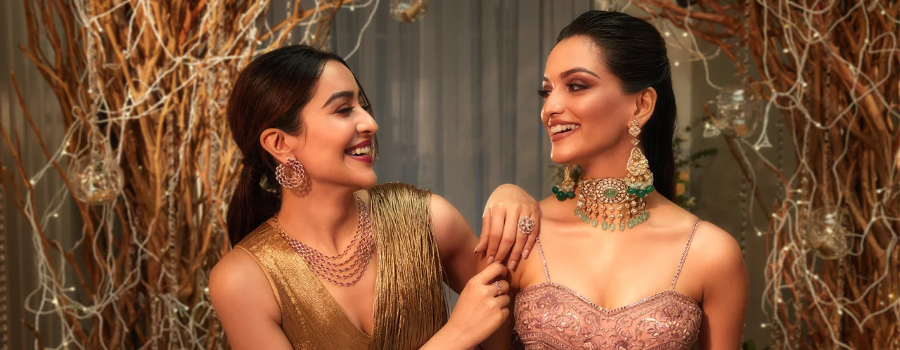 Two women in glamorous outfits with elegant jewellery