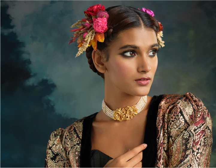 Model wearing a traditional lush gold choker necklace collection with pearl strings