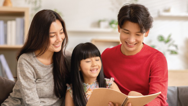 parents reading with kid