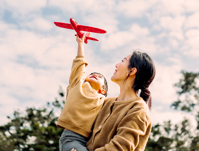 father and son playing soccer